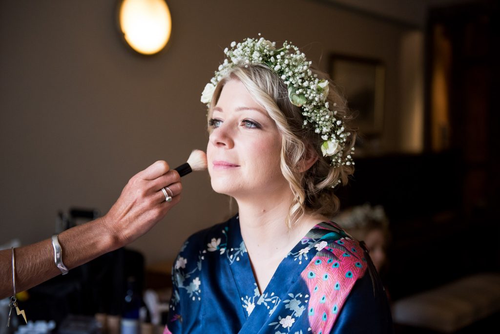 Bride wearing floral crown hair and make up by Suzi Winter Cornwall
