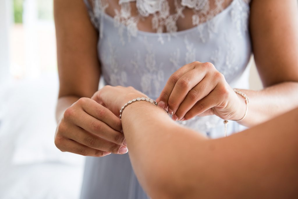 Coast bridesmaids with matching bracelets 