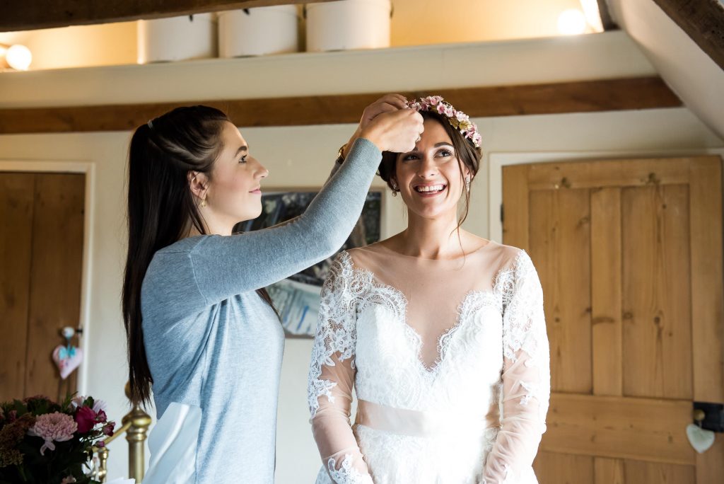 Smiling Jay West Bride wearing floral crown pre wedding photography Norfolk