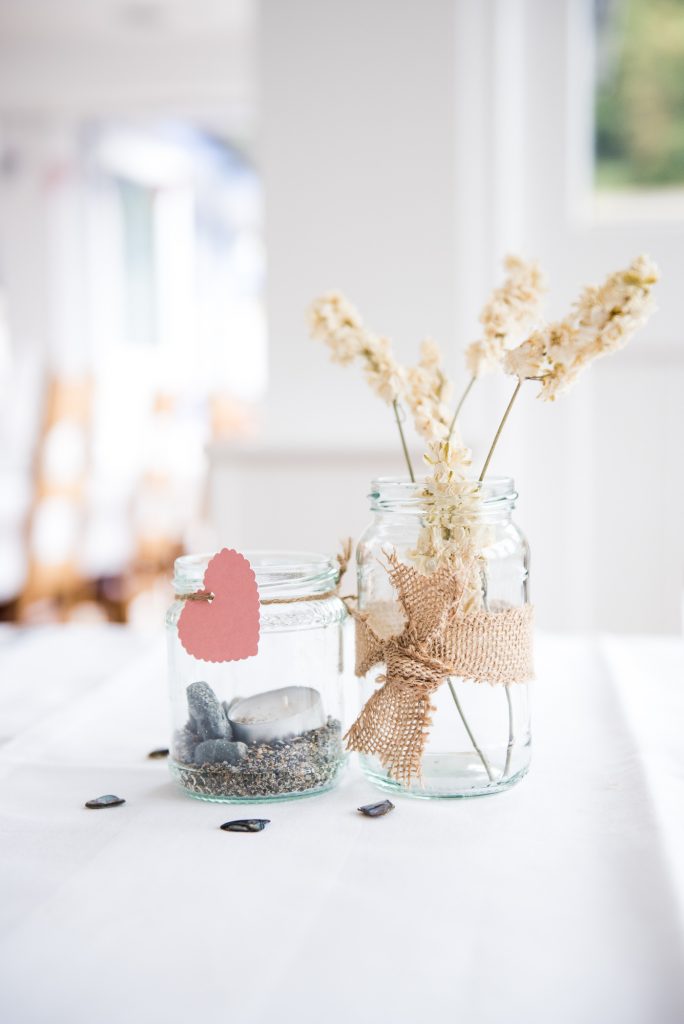 Pebbles and dried wild flower natural wedding decor Cornwall