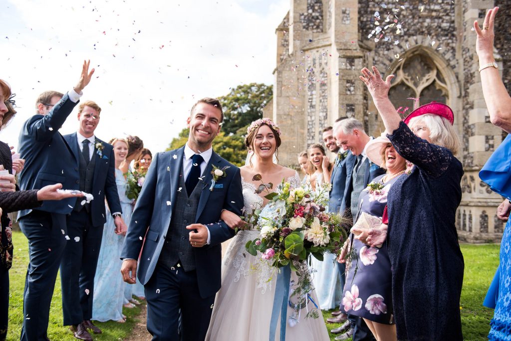 Confetti wedding portrait bride holding bouquet by Flowers at The Forge Norfolk