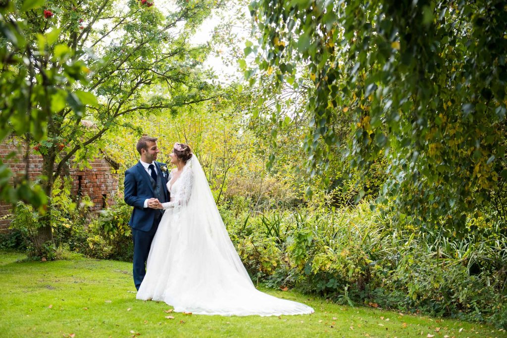 Jay West Bride with Calvin Klein groom Norfolk Barn wedding portrait