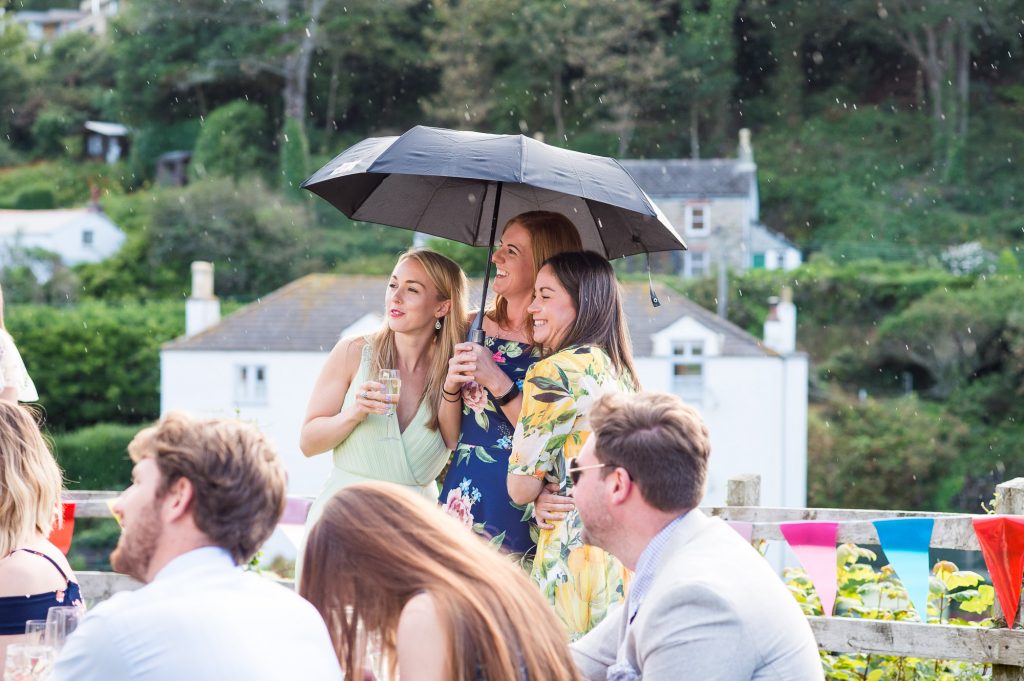 Wedding guests enjoy outdoor beach wedding Cornwall