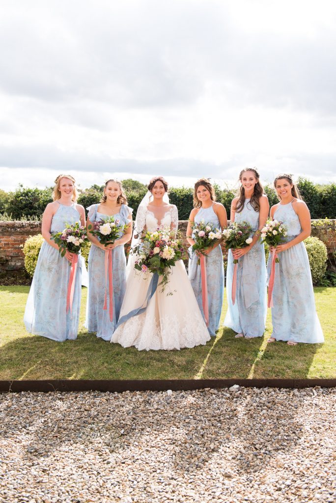 Bride with pastel blue bridesmaids Spixworth Hall wedding