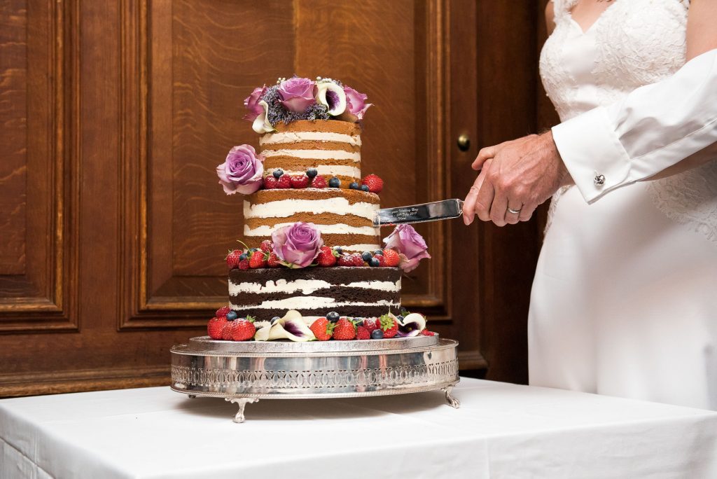 Cutting the cake Surrey wedding photography