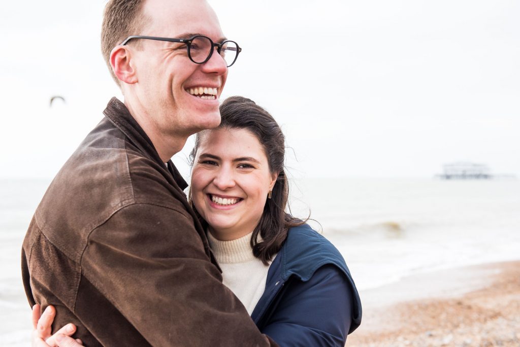 Smiling and happy couple on Brighton beach