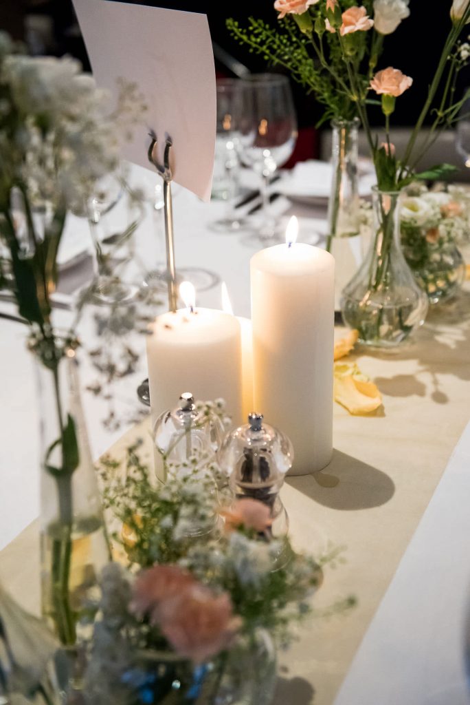 White floral arrangements with candles London wedding