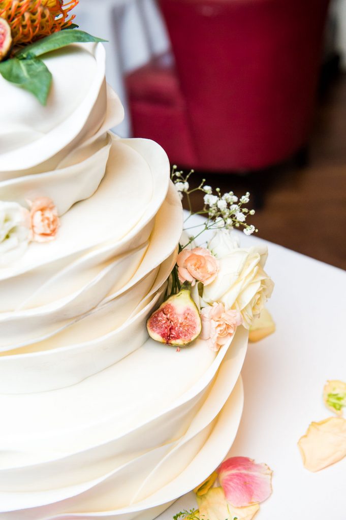 Stunning three tier white wedding cake with sugar decorations London