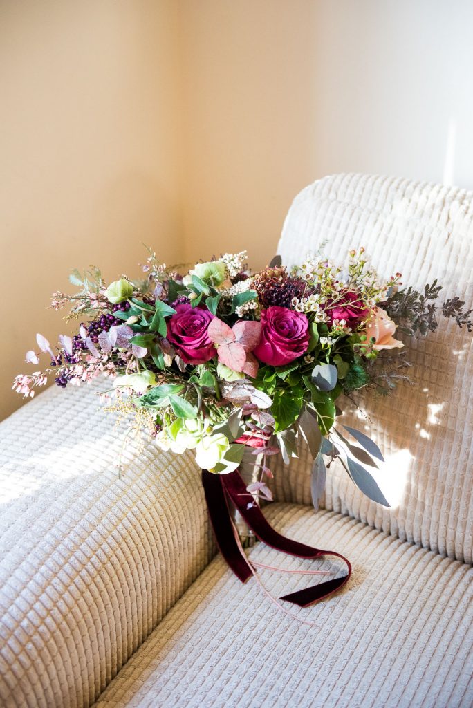 Ashridge House Wedding. Natural Wedding Photography. Bridal bouquet with winter blooms by Myrtle and Bloom. 