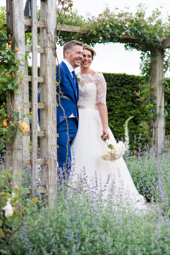 Great Fosters. Natural Wedding Photography Surrey. Wedding Portrait in The Lavender Garden.