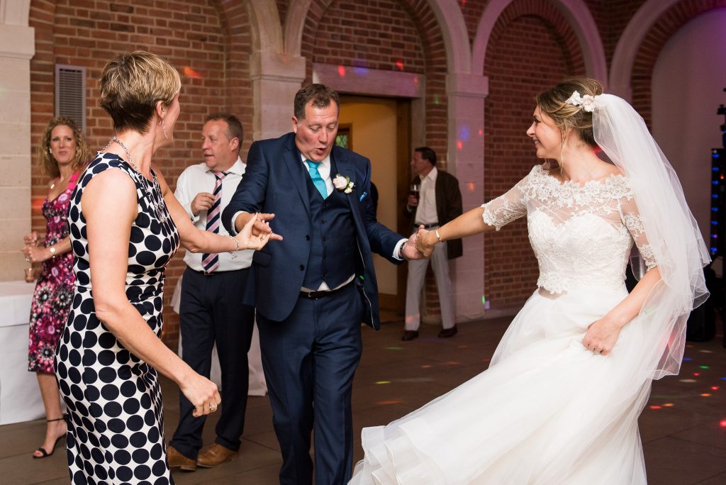 Great Fosters. Natural Documentary Wedding Photography, Surrey. Fun and Candid Dance Floor Photography.