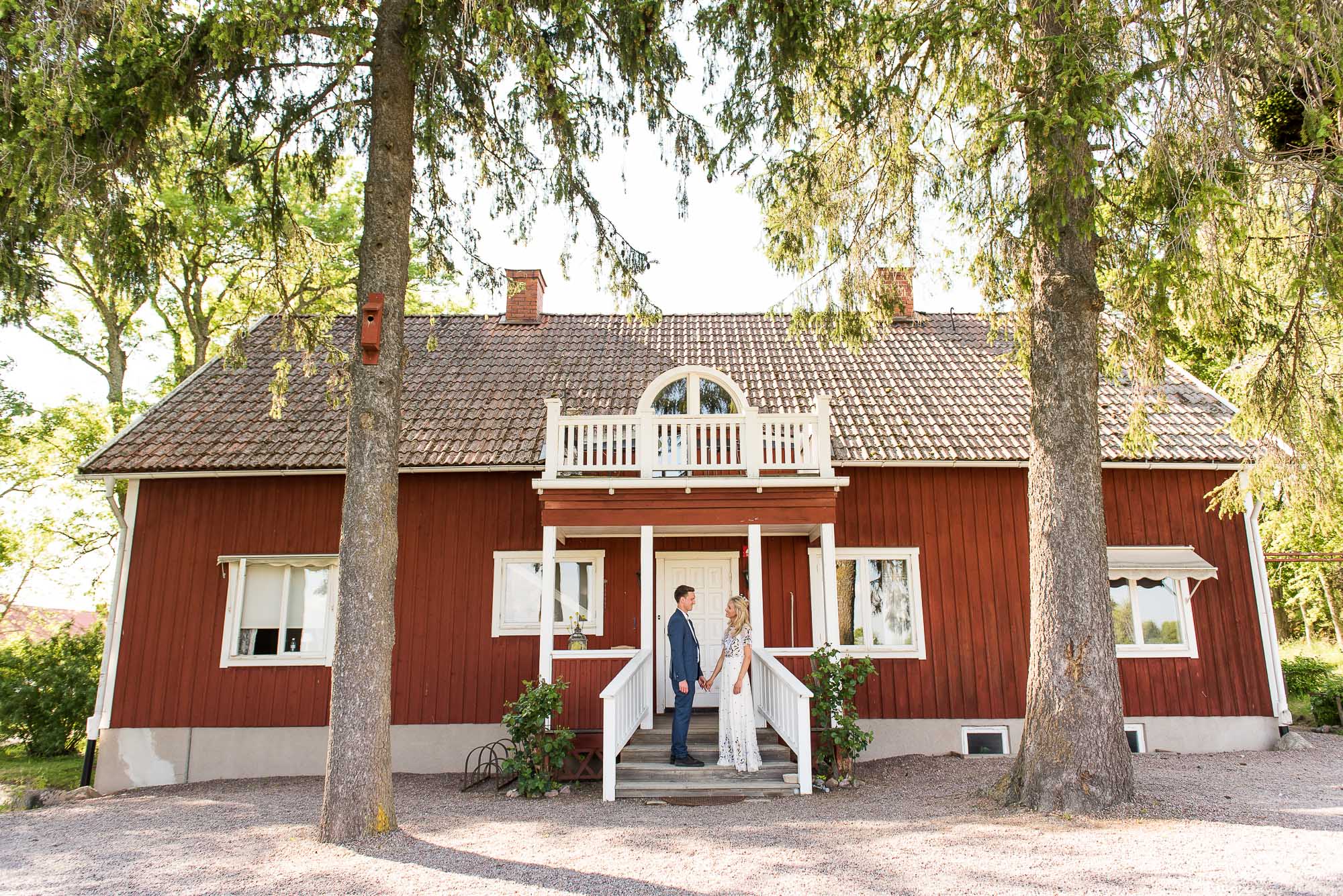 Swedish Wedding - Kroksta Gard Wedding - Natural and Candid Couples Portrait With Traditional Red Swedish Barn