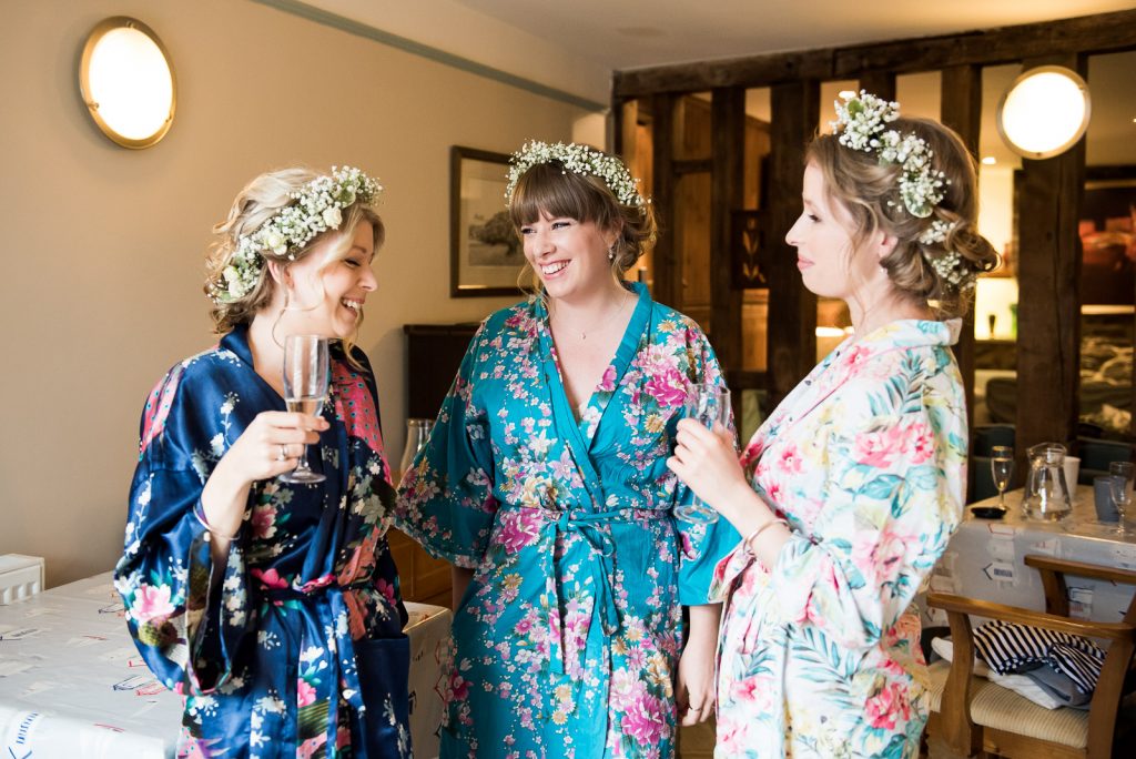 Wedding Day Timeline - Bridesmaids Laughing During Bridal Prep - Outdoor Surrey Wedding