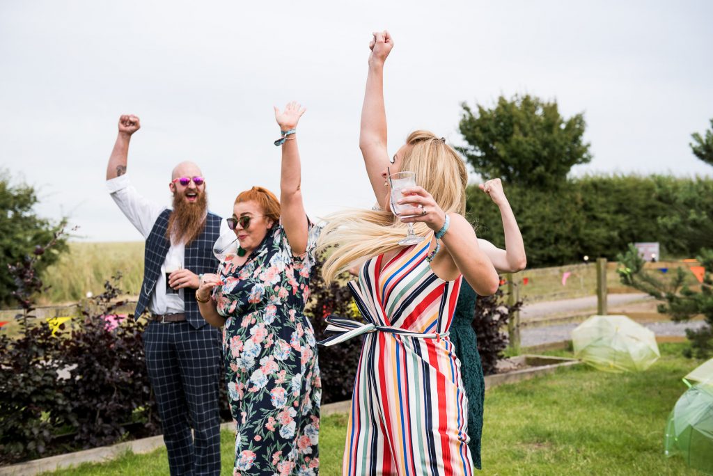 Wedding Photography Under £500, Wedding Guests Cheering At Garden Games
