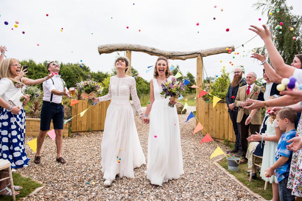 Inkersall Grange Farm Wedding - Same Sex Wedding Photography - Gorgeous Boho Brides Walk Down Pom Pom Confetti Aisle