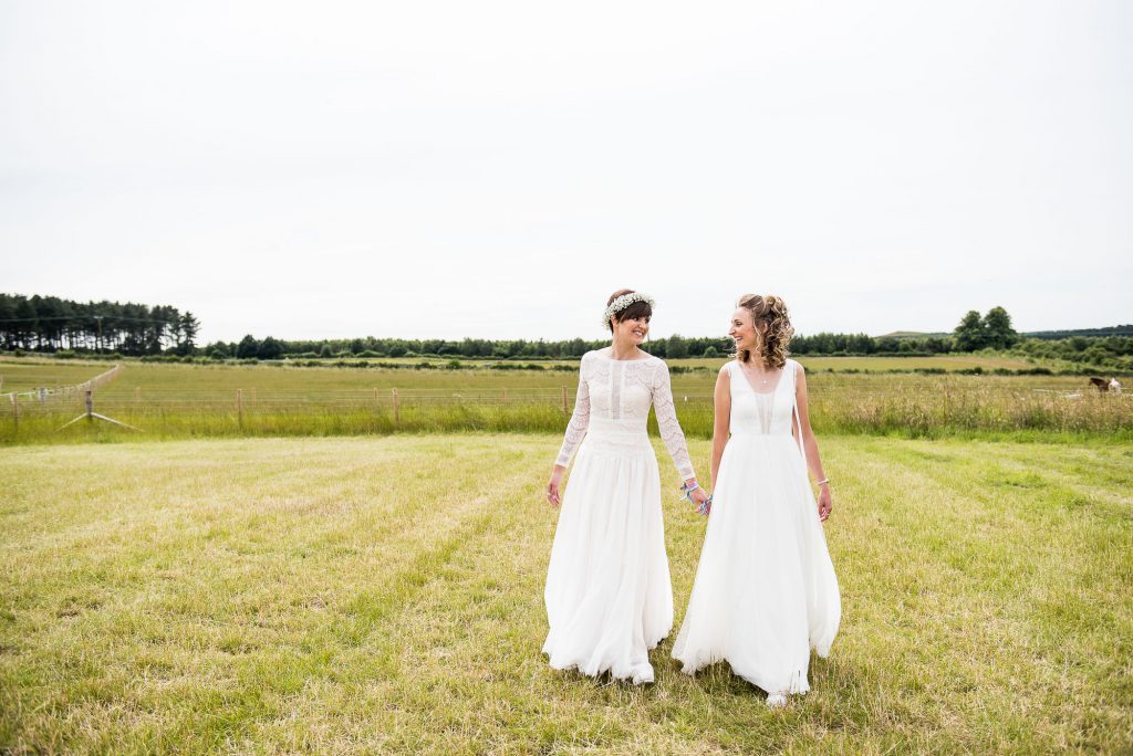 Inkersall Grange Farm Wedding - Same Sex Wedding Photography - Beautiful Boho Brides Walk Together