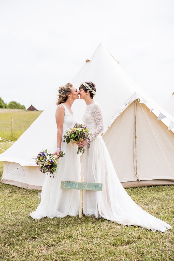 Inkersall Grange Farm Wedding - LGBT wedding photographer  - Brides By Wedding Bell Tents Sharing a Kiss