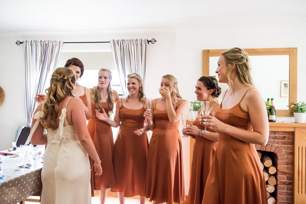Gorgeous Bride Reveals Her Catherine Deane Bridal Gown To Her Bridesmaids