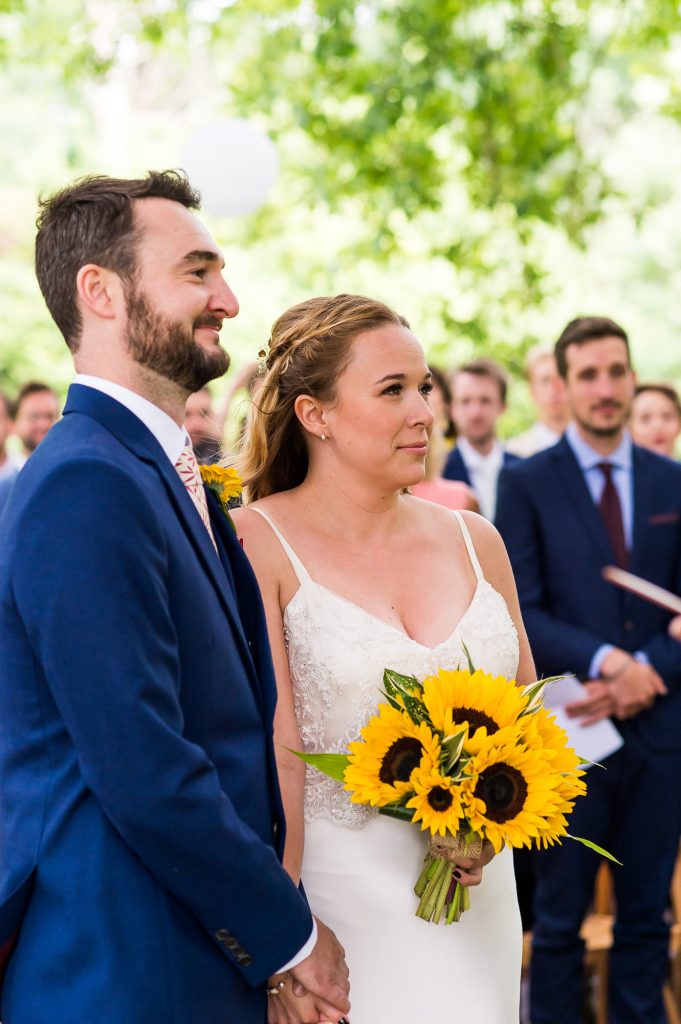 Outdoor Wedding Ceremony, Surrey Wedding Photography, Gorgeous Catherine Deane Bride with Sunflower Bouquet During The Wedding Ceremony