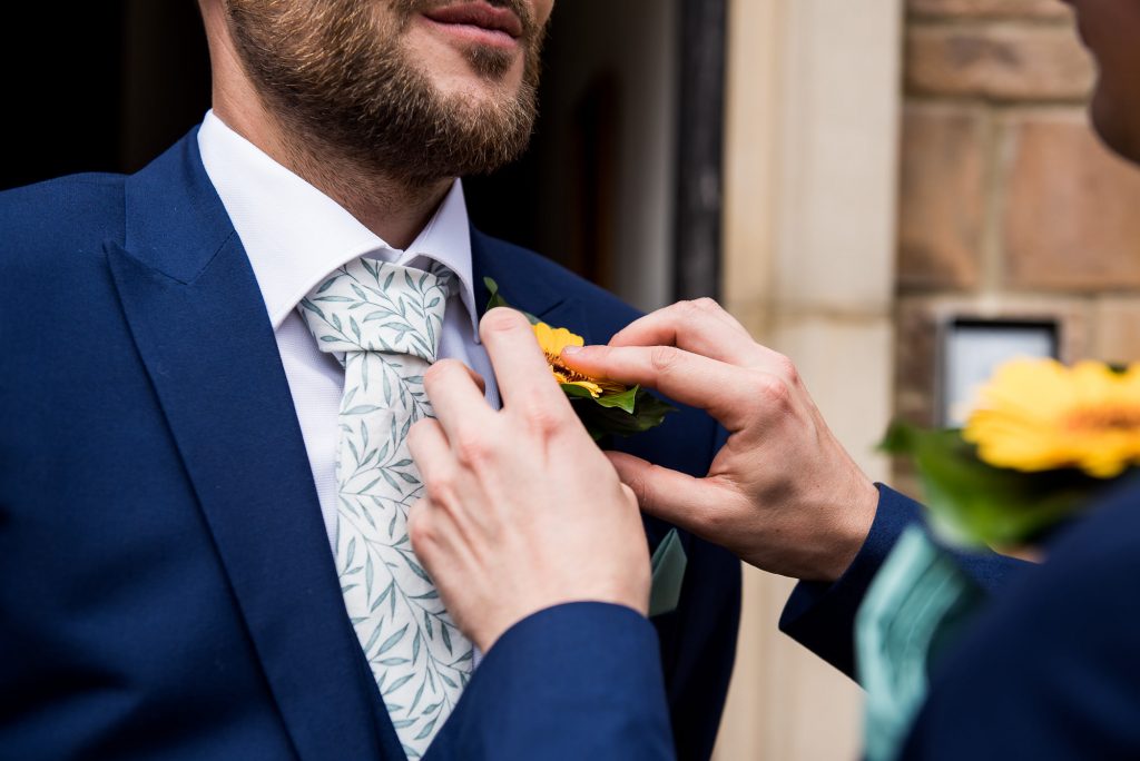Outdoor Wedding Ceremony, Surrey Wedding Photography, Groomsmen Has His Button Hole Applied