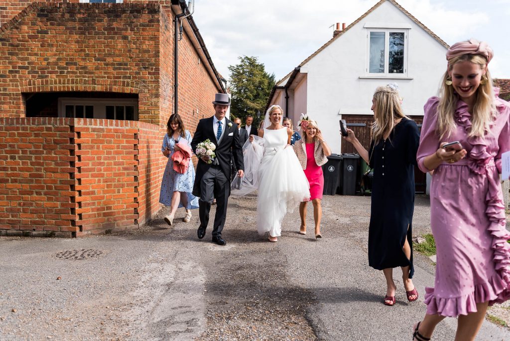 Outdoor Wedding Photography Surrey, Guests Walk From The Church To The Garden Reception