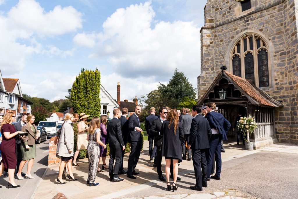 Outdoor Wedding Photography Surrey, Guests Arriving At Chobham Church In The Sunshine, Surrey Wedding Photography