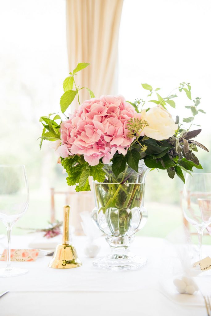 Outdoor Wedding Photography Surrey, Large Pink Hydrangea Flower Display with Traditional Danish Gold Bell 
