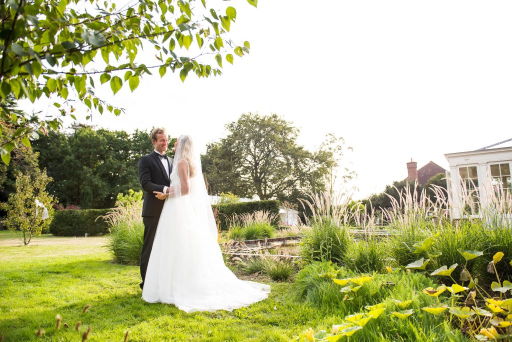 Outdoor Wedding Photography Surrey, Elegant Bride and Groom Bathed In Golden Hour Light, Surrey Wedding Photography