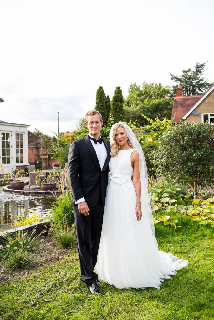 Outdoor Wedding Photography Surrey, Gorgeously Elegant Couple In Black Tie Stand For A Portrait
