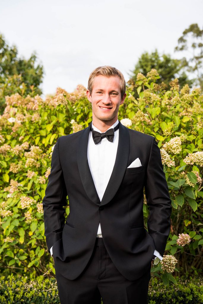 Outdoor Wedding Photography Surrey, Handsome Groom In Black Tie Dress With White Shirt and Bow Tie