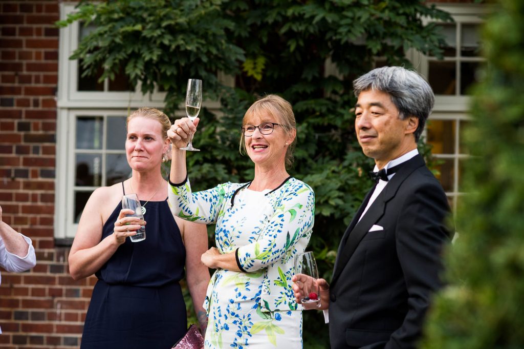 Outdoor Wedding Photography Surrey, Glamorous Wedding Guests Enjoy an Outdoor Black Tie Wedding Reception
