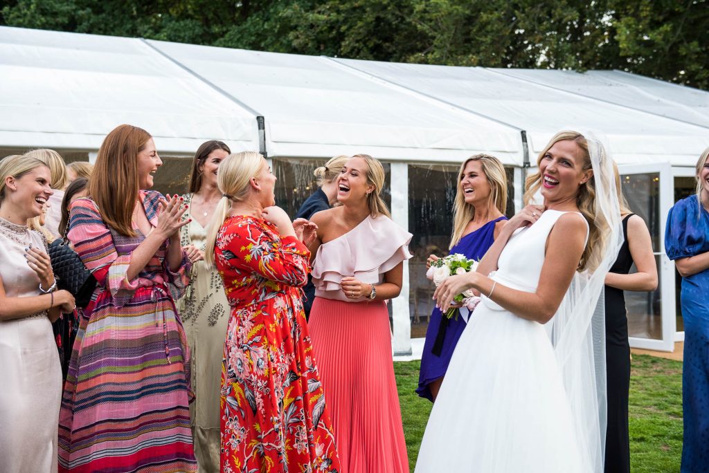 Outdoor Wedding Photography Surrey, Glamorous Bride Laughing With Her Friends