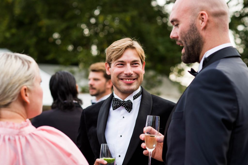 Outdoor Wedding Photography Surrey, Happy Guests Enjoy A Glamorous Black Tie Reception