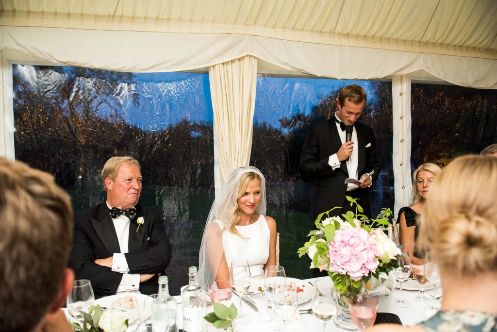 Outdoor Wedding Photography Surrey, Wedding Party Listen As Groom Gives A Speech