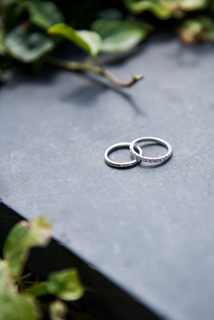 lgbt wedding photographer, Wedding rings arranged together