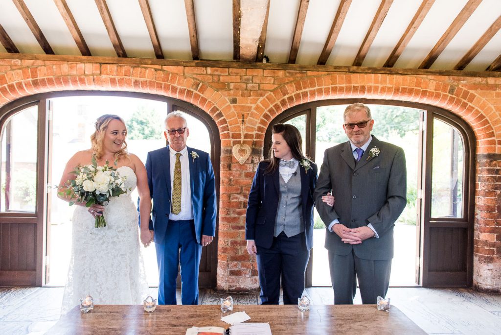 lgbt wedding photographer, Brides arrive at the alter with their fathers, Same Sex Wedding Ceremony