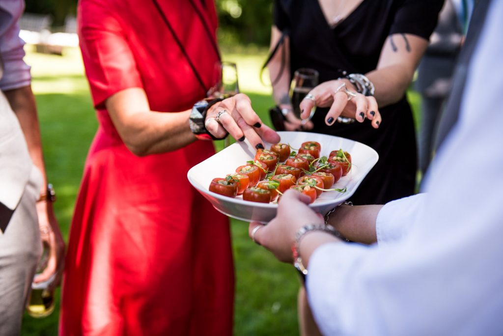 lgbt wedding photographer, guests enjoy gourmet canapés