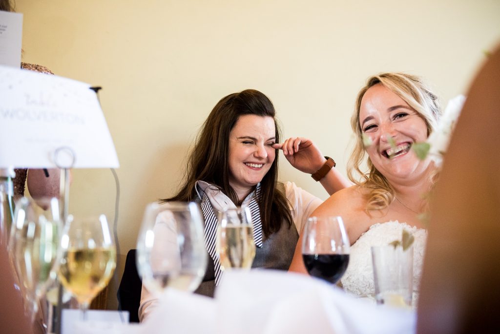 lgbt wedding photographer, brides share an intimate moment during speeches, Dodmoor House Wedding