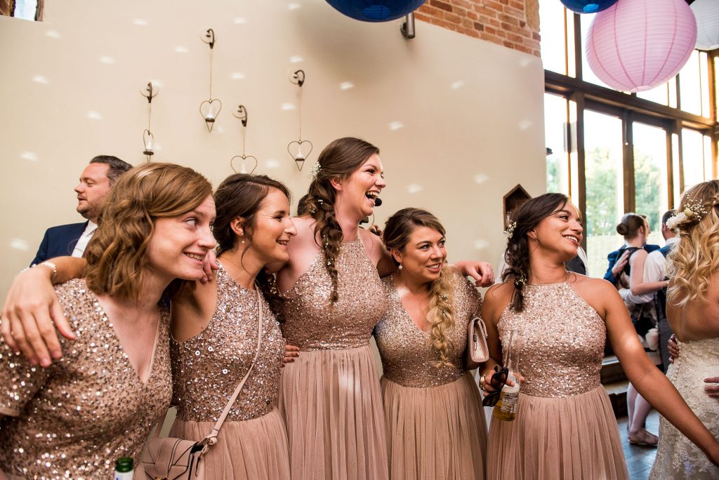 lgbt wedding photographer, bridesmaids share a dance on the dancefloor