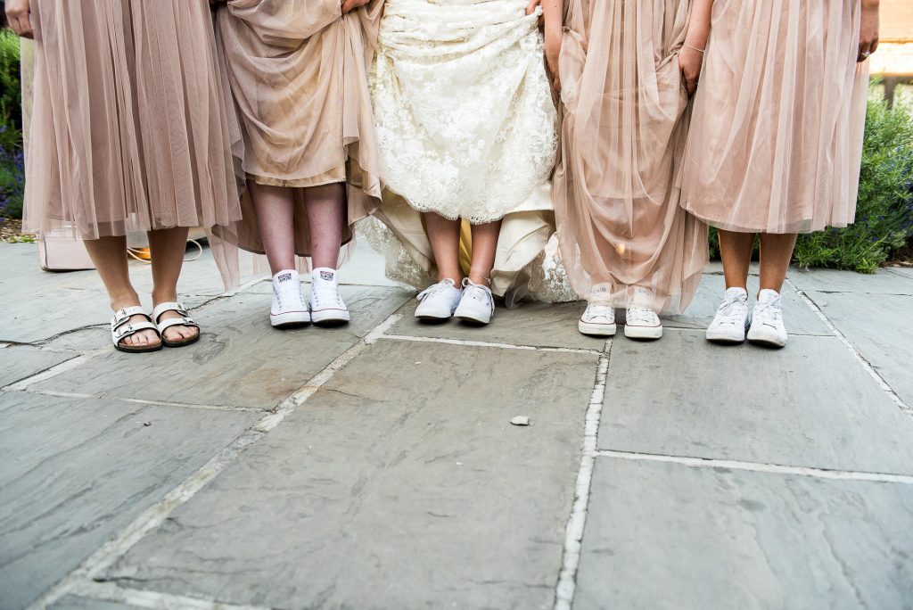 lgbt wedding photographer, bridesmaids and bride wear matching shoes for the evening reception