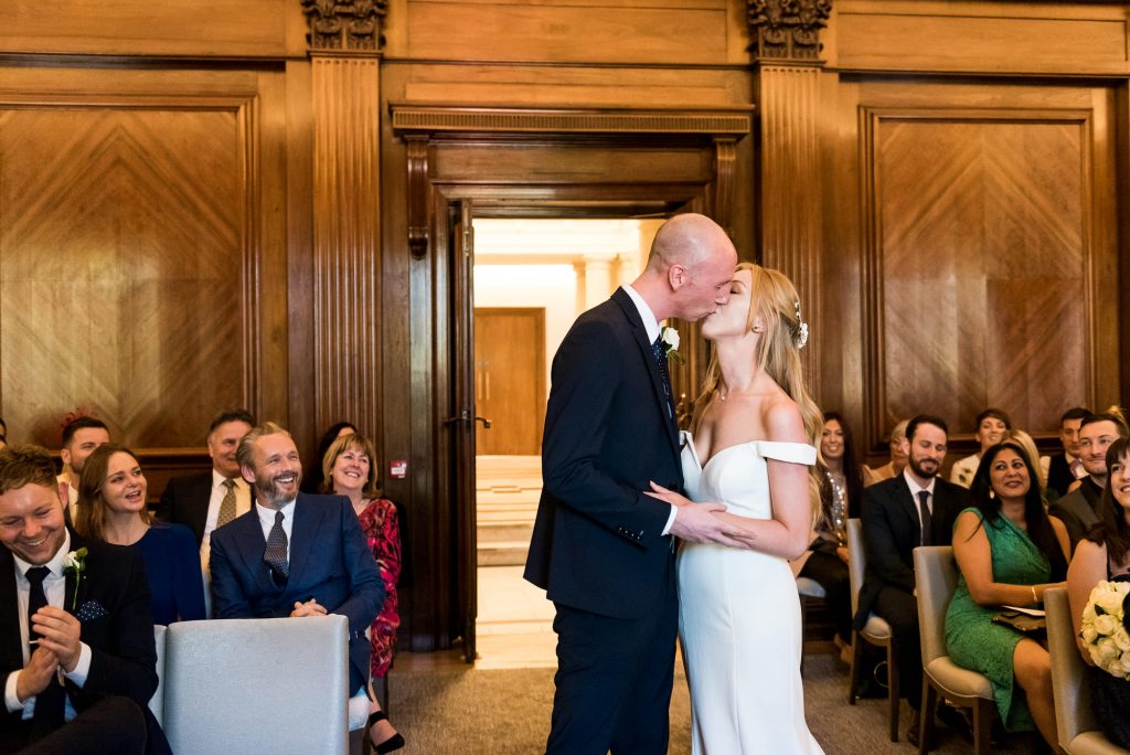 Old Marylebone Town Hall Wedding, Bride and groom share first kiss