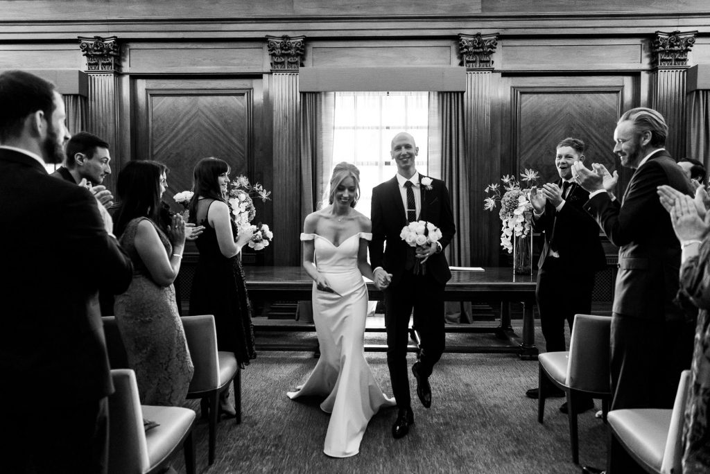 Old Marylebone Town Hall Wedding, Bride and groom walk down the aisle as a married couple