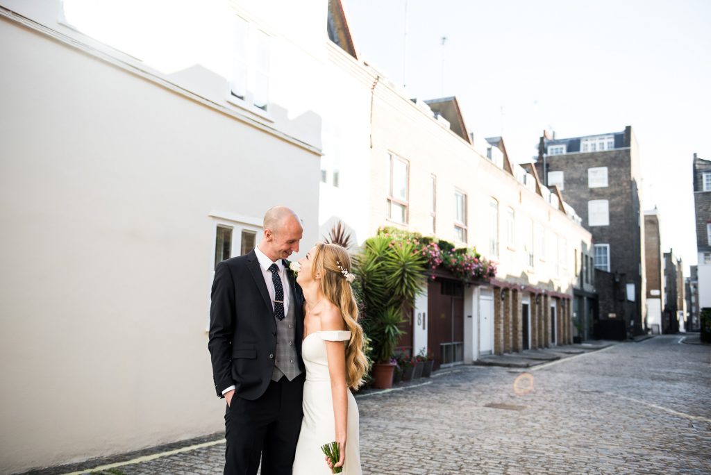 Old Marylebone Town Hall Wedding, candid couples portrait in traditional London mews