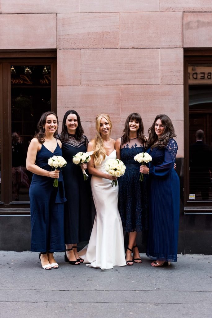 Old Marylebone Town Hall Wedding, miss-matched navy blue bridesmaid dresses with elegant Sherri Hill bride