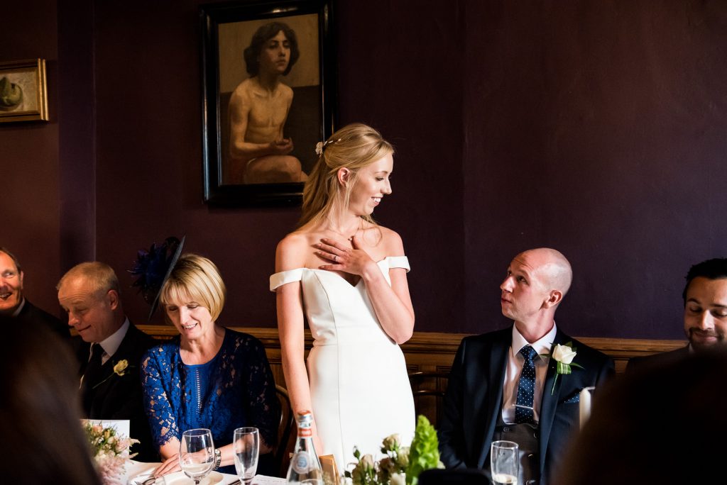 Old Marylebone Town Hall Wedding, bride in a sleek and stylish wedding dress gives emotional wedding breakfast speech