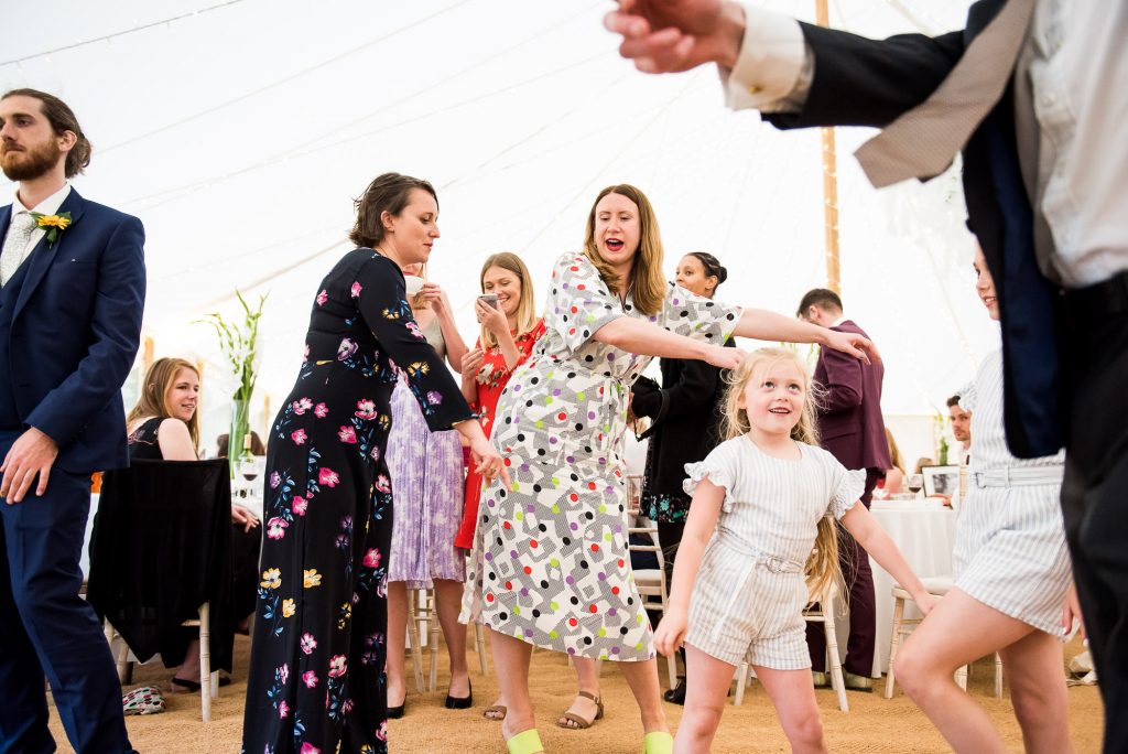 LGBT wedding photography, wedding guests dancing the floss with children