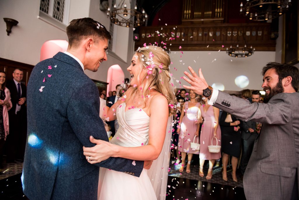 guests throw confetti on the bride and grooms first dance