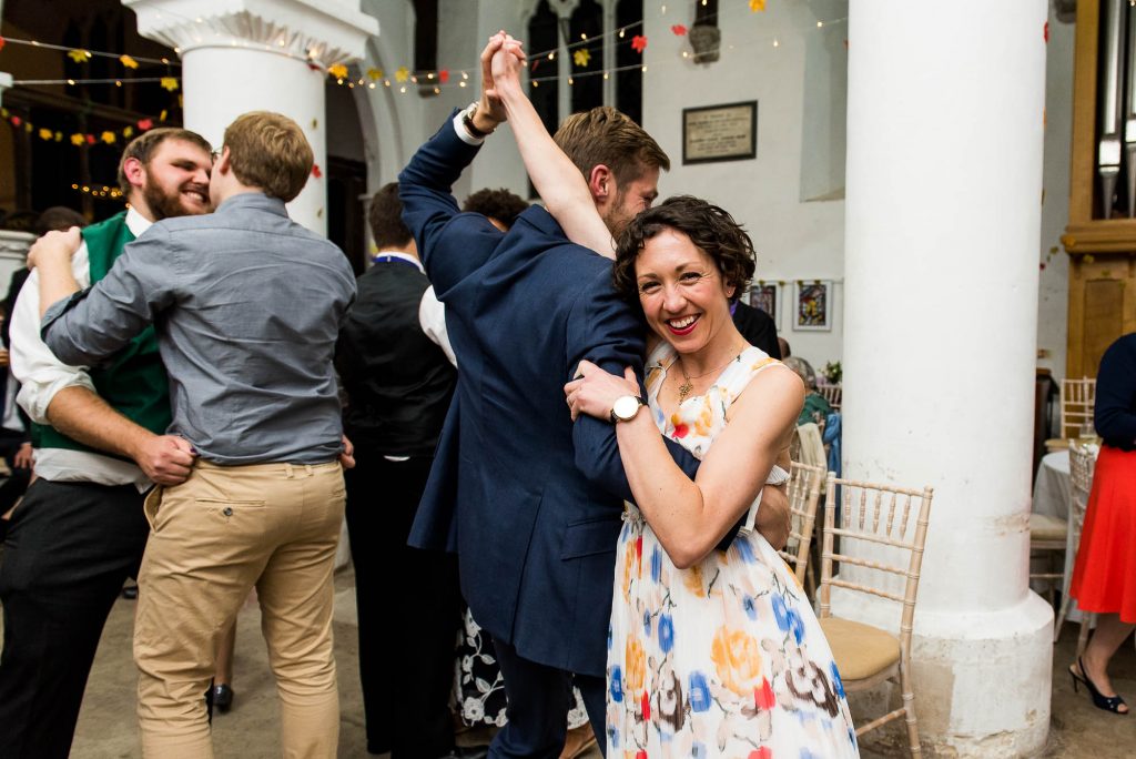 Documentary wedding photographer surrey, Couple dance together at Surrey wedding