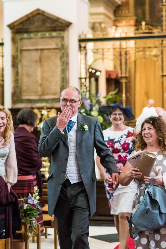 Father of the bride blows a kiss