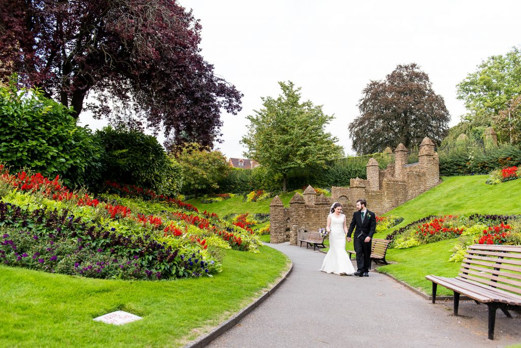 Couple walk through Guildford Castle gardens together